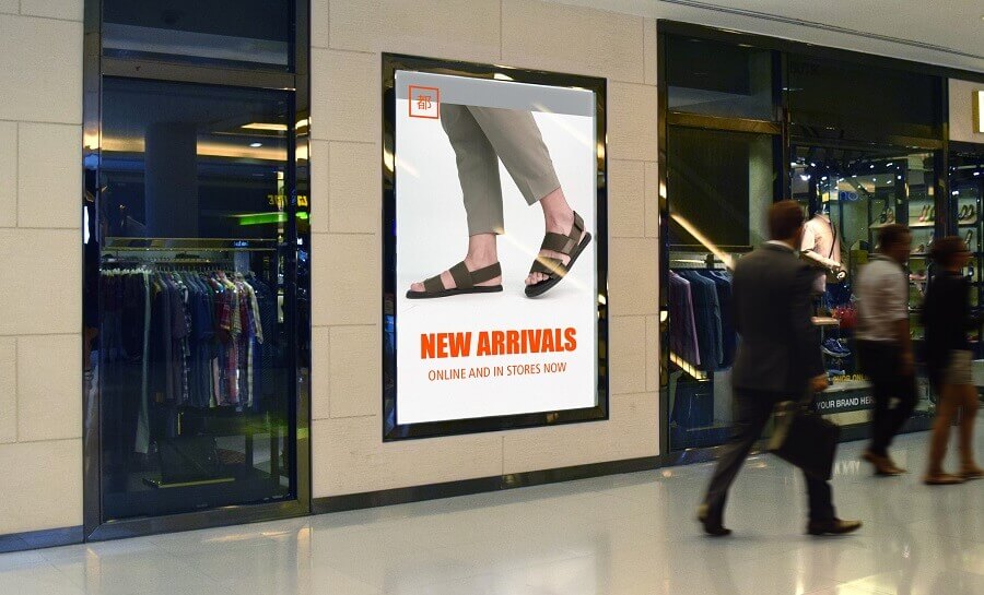 A digital sign advertising fashion products with a man walking by. Not everyone understands that they are being tracked by many digital signage installations.