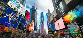 <p>Times Square in 2019. A number of digital billboards are in view, some of which may be transacted on programmatically</p>