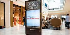 A totem in a shopping mall. Its screen is 1080x1920 portrait display.