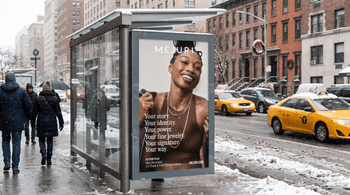 Mejuri digital out-of-home ad displayed at a snowy New York City bus shelter, featuring a model wearing fine jewelry.