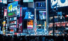 <p>Digital displays standing tall over an intersection in Shibuya, Japan.</p>
