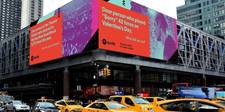 A large, colourful Spotify billboard high up on a street corner. It says "Dear person who played "Sorry" 42 times on Valentine's Day, what did you do?"