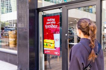 Smartify Media digital screen outside a retail store in Sussex, New York, displaying a Pret advertisement.