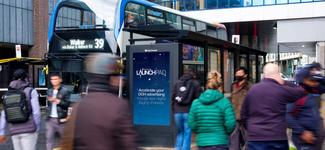 <p>A Clear Channel display by a bus terminal. This and other displays in Clear Channel&#8217;s network are now available to transact on programmatically via Broadsign Reach.</p>
