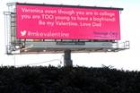 A pink billboard with the hashtag #mkevalentine. The text is from a Tweet that says &quot;Veronica even though you are in college you are TOO young to have a boyfriend! Be my Valentine. Love Dad.