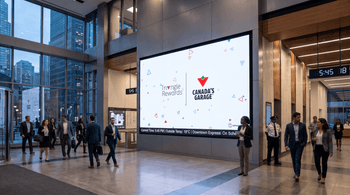 Canadian Tire Canada’s Garage and Triangle Rewards digital billboard displayed in a busy downtown office building.